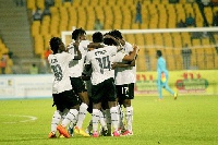 Team Black Queens celebrating a goal