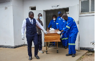 A coffin with the body of a ferry victim leaves Kariba hospital mortuary