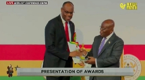 The award was presenter by President Nana Akufo-Addo [R]