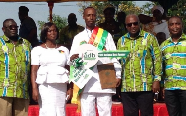 Robert Crentsil [Middle] in white flanked by president John Mahama and others.