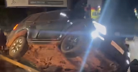 The driver became trapped inside the vehicle until passengers intervened to flip it back over