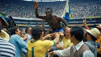The late Pele being carried shoulder high