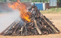 File photo: Heaps of illegal arms being destroyed