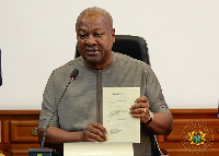 John Dramani Mahama after signing the bill