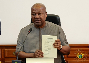 John Dramani Mahama after signing the bill
