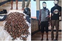 Two of the suspects and the items seized from them