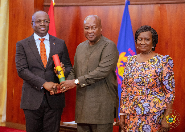Dr Omane Boamah (left) was sworn in by President Mahama (middle) last week