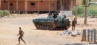 Sudanese army armoured vehicles are stationed on a street in southern Khartoum on May 6