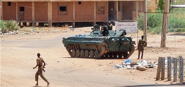 Sudanese army armoured vehicles are stationed on a street in southern Khartoum on May 6