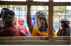 Newly arrived Somali refugees wait at the profiling and registration centre in Dadaab refugee camp