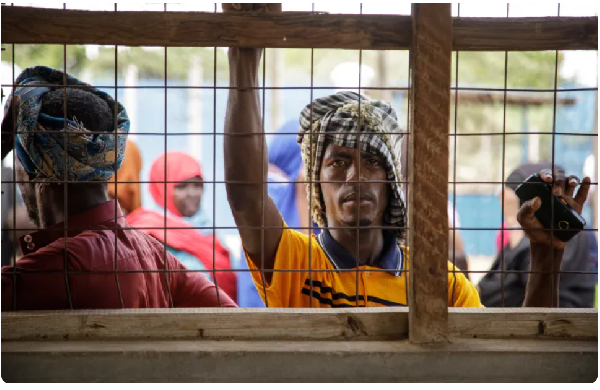 Newly arrived Somali refugees wait at the profiling and registration centre in Dadaab refugee camp