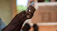 Health workers prepare to give malaria vaccines in Malawi