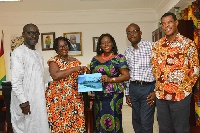 Sector Minister Catherine Afeku being presented the National Theater 5-year strategic plan
