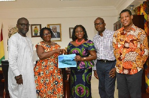 Sector Minister Catherine Afeku being presented the National Theater 5-year strategic plan