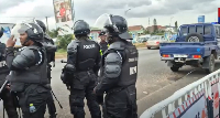 An old photo of police personnels at a site