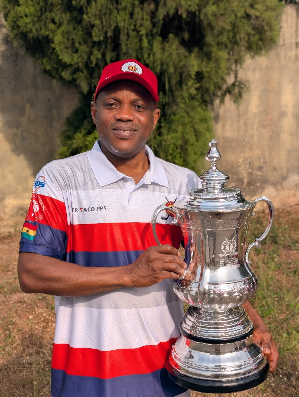 Captain One Golf Society President Mr Appiah with the tournament trophy