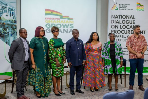 Apparel manufacturers and policy stakeholders in a group photo at the event