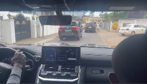 A long convoy of cars transporting the Minority members to Jubilee House