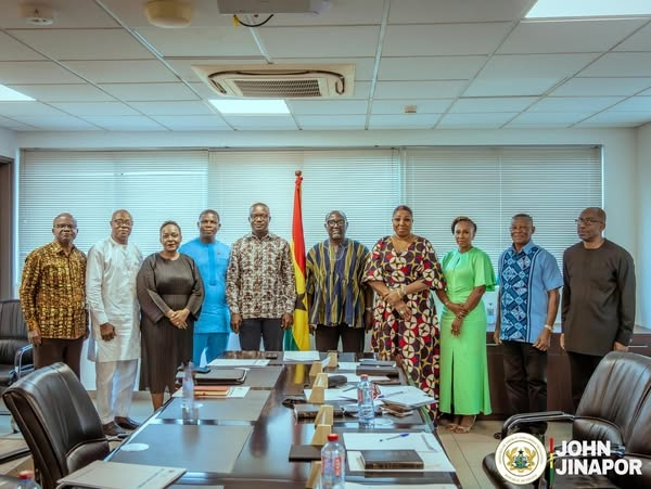 The board members in a group photograph after being sworn in by the minister