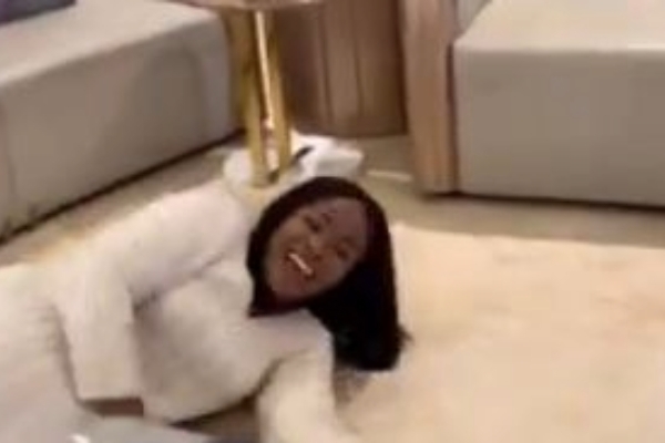 Chef Faila laying on the floor at Mahama's residence