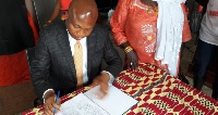 Samuel Okudzeto Ablakwa signing the petition
