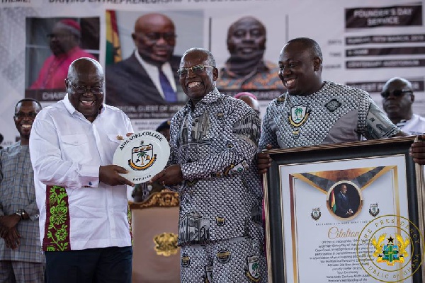 President Akufo-Addo receiving a citation and a plaque at the 109th anniversary of Adisadel College