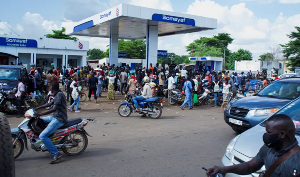 People gather at a petrol station due to shortage of petrol in Bamako, Mali
