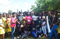 Members of GALs World in a group picture with some of the students