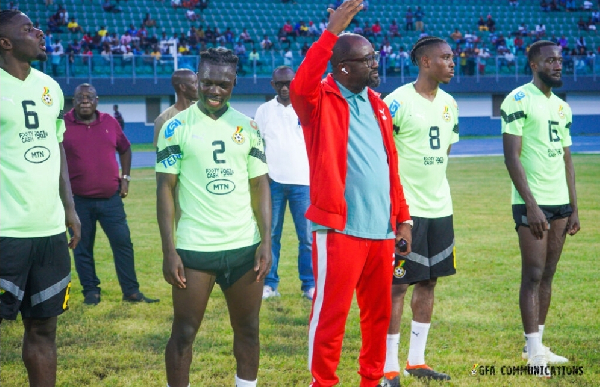 Kurt Okraku with Black Stars players