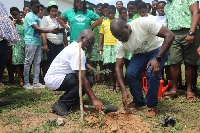 The authorities planting a tree during the event