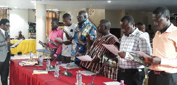 Officials of Sefwi Akontombra District Assembly take the oath of office at the PAC hearing