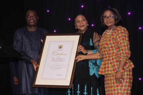 Mrs Rebecca Akufo-Addo receiving a citation from Minister for Business Development, Mohammed Awal