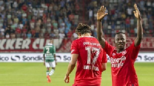Ghana midfielder Yaw Yeboah with arms raised