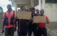 The students holding placards during the demo
