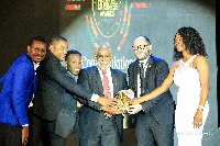 CEO of Advans Ghana (second right), Olivier Bailly-Béchet, with other employees receiving the reward