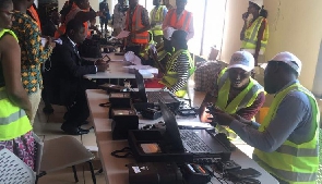 Officials registering individuals for Ghana Card