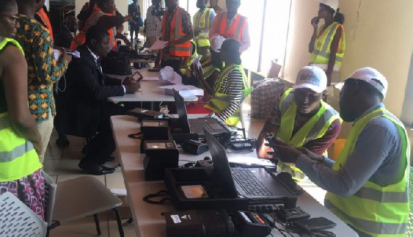 File photo of NIA staff taking Ghanaians through the Ghana Card registration process