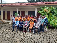 Dr Nii Moi Thompson in a group picture with staff and students of Vilac Int. School