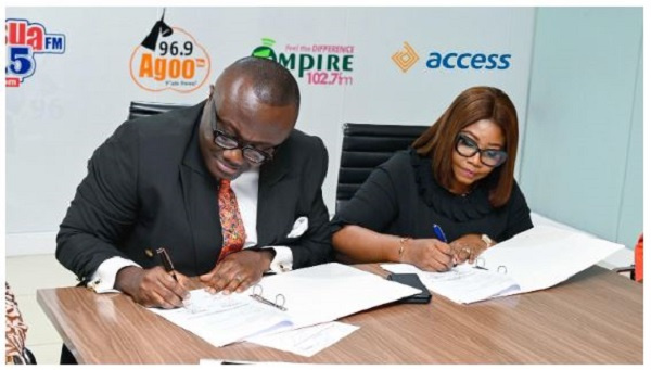 Matilda Asante-Asiedu and CEO of EIB Network, Nathan Anokye Adisi signing the partnership docume