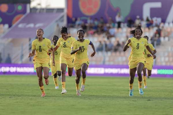 Black Queens players celebrating their win against Algeria