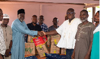 Among the items he presented were 30 bags of rice, 10 boxes of cooking oil and boxes of mackerel