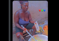 A picture of the plantain chips seller demonstrating the frying