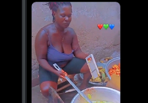A picture of the plantain chips seller demonstrating the frying