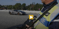 A French police officer patrols at the France Italy border