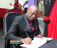 Dr Henry Kwabena Kokofu signs KABA