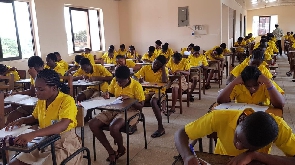 Some students in an examination hall