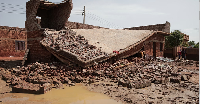 Damage is seen after a heavy rainfall in a village in Sudan
