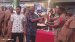 Ashanti Regional Commander of the GNFS presenting an award to the winners
