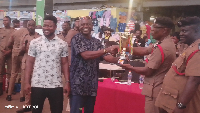 Ashanti Regional Commander of the GNFS presenting an award to the winners