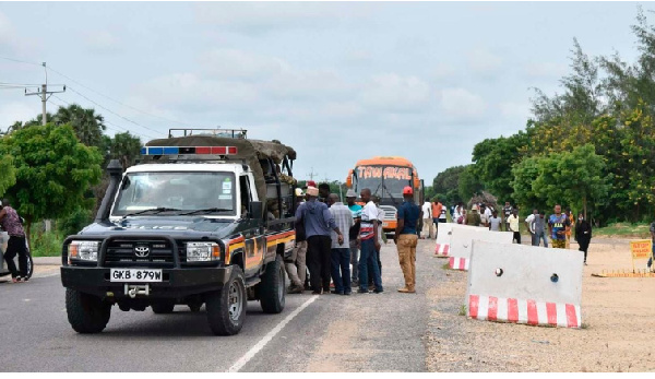 Security officers escort public service vehicles along the volatile Gamba-Witu road in Lamu County